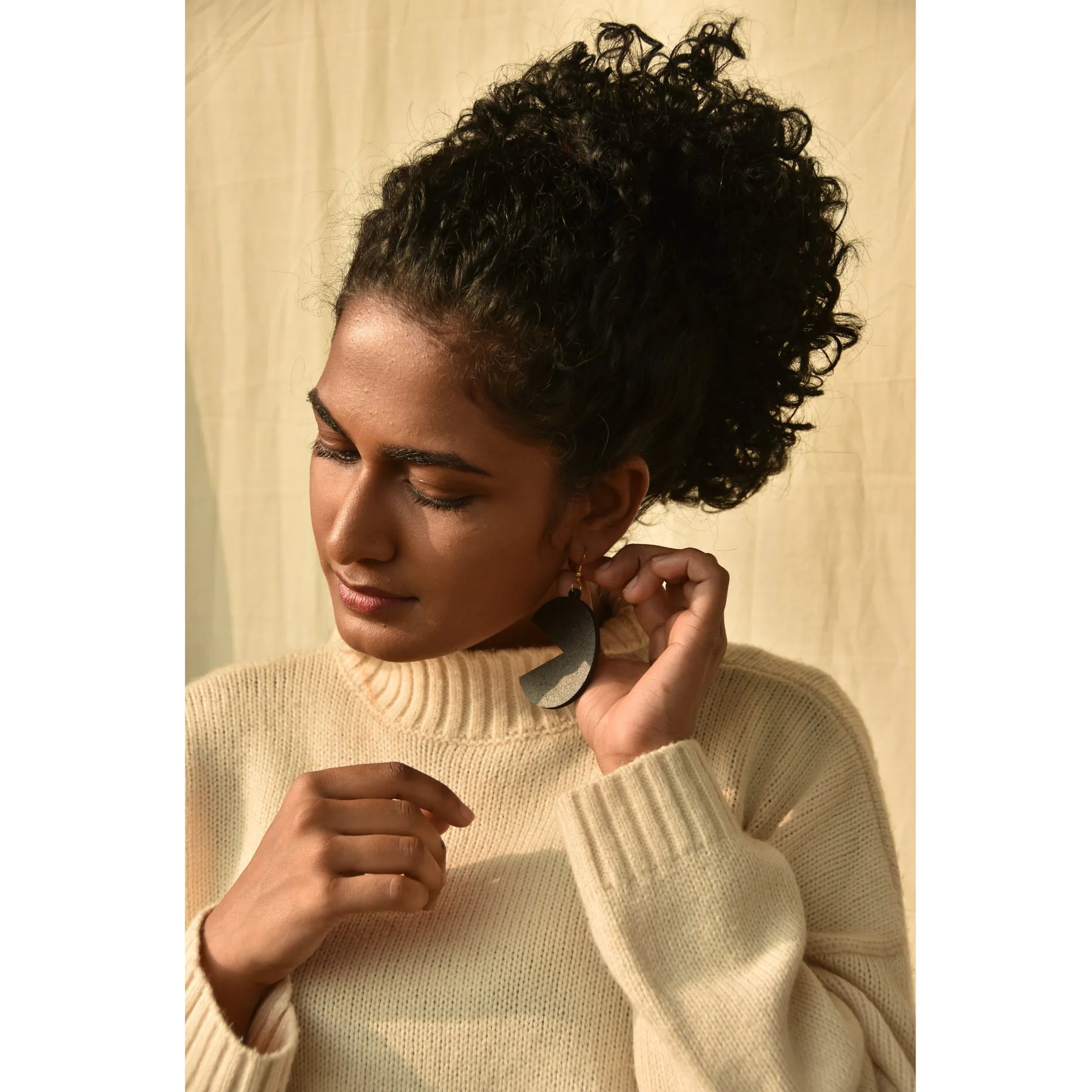 Model wearing AD'NOVEL earrings